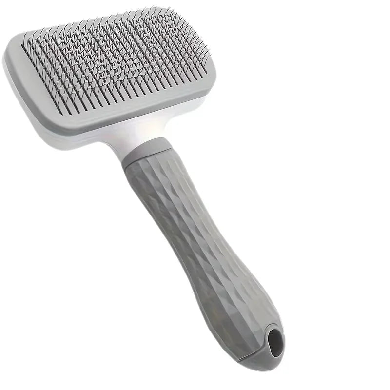 Coloris gris, bleu et rose de la brosse de massage pour chien