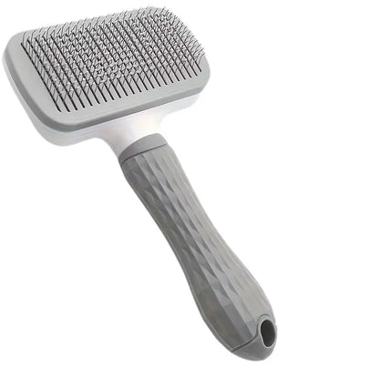 Coloris gris, bleu et rose de la brosse de massage pour chien